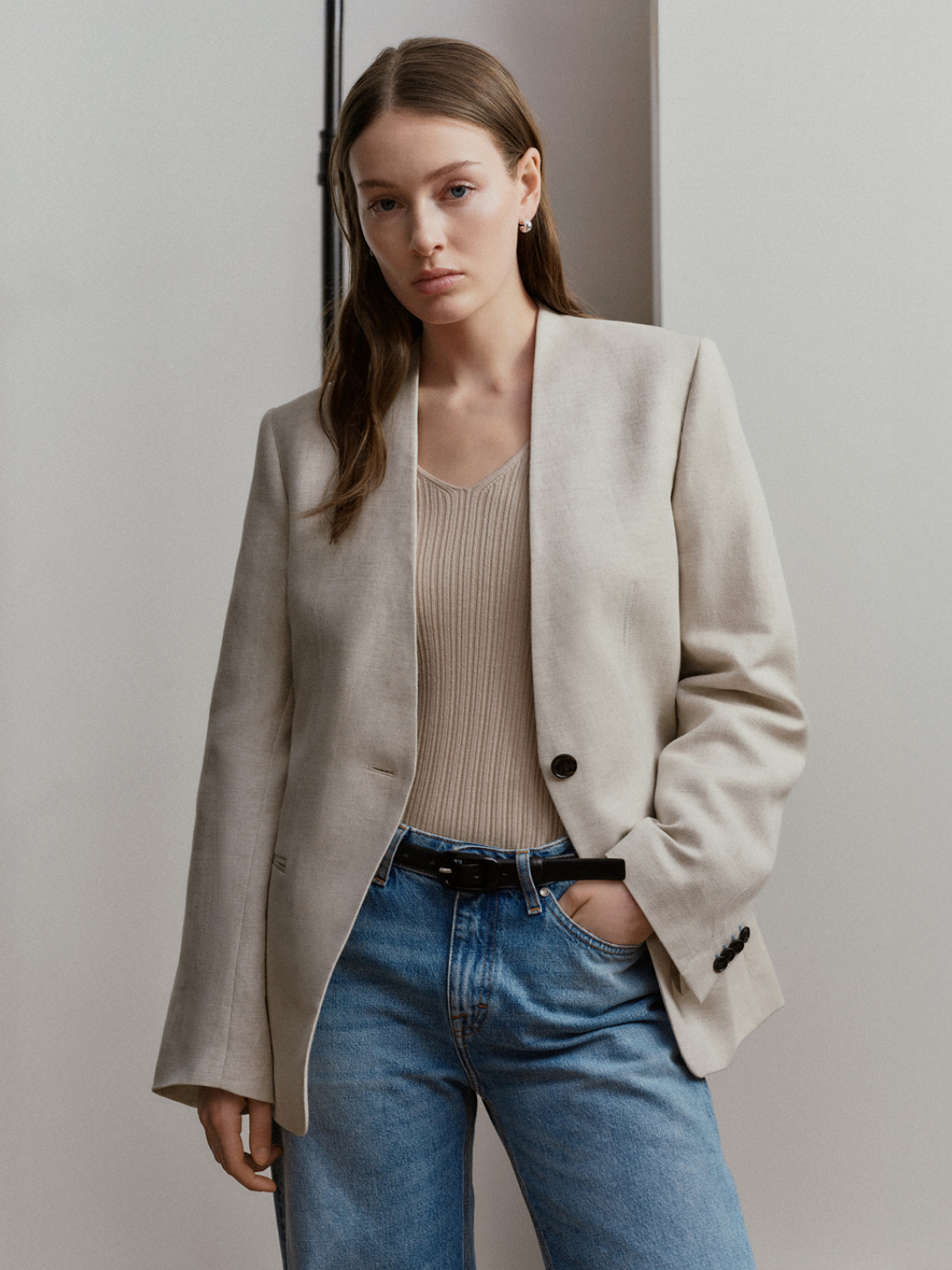 woman wearing denim and linen jacket